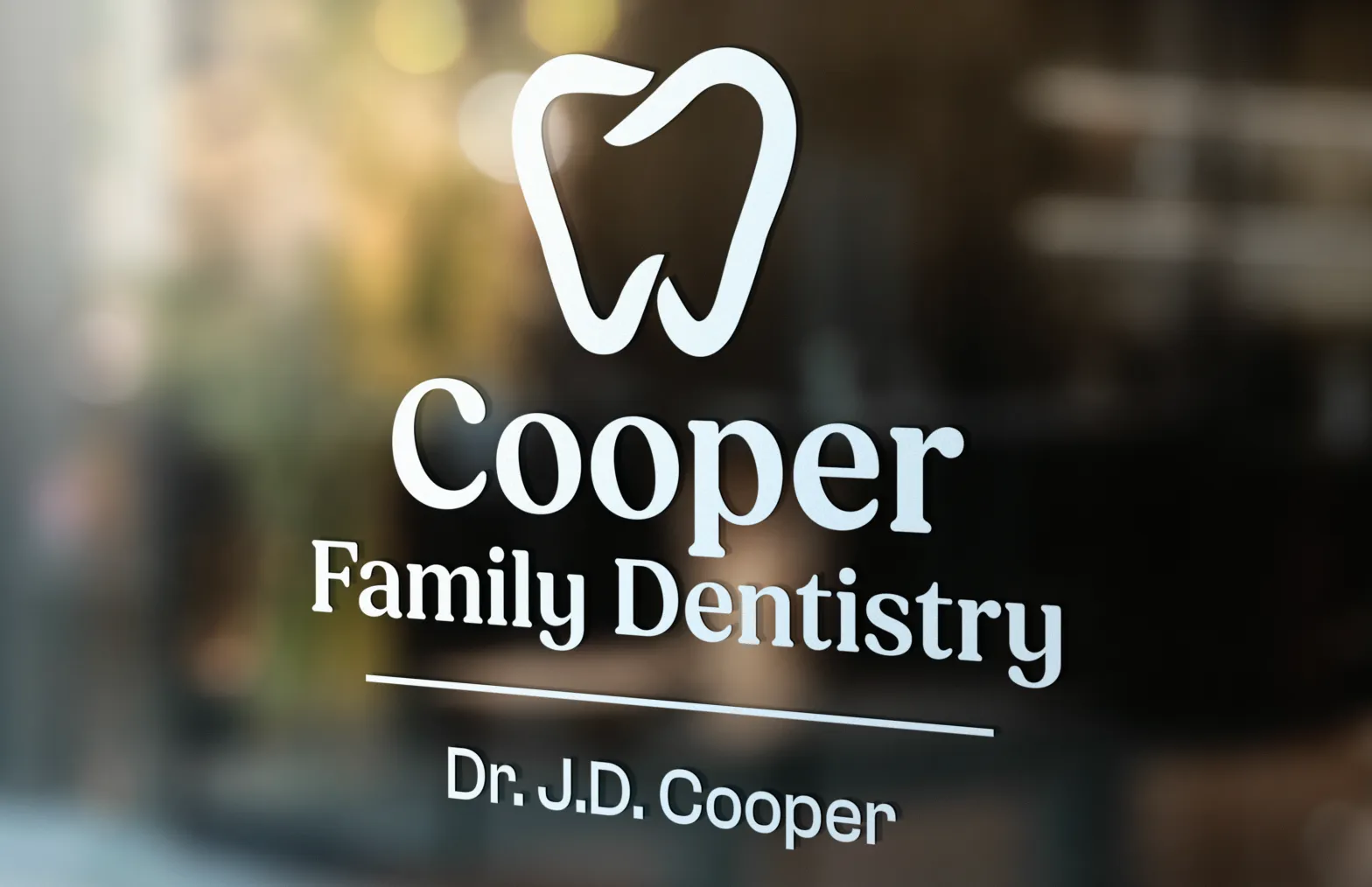 Cooper Family Dentistry logo on a glass door