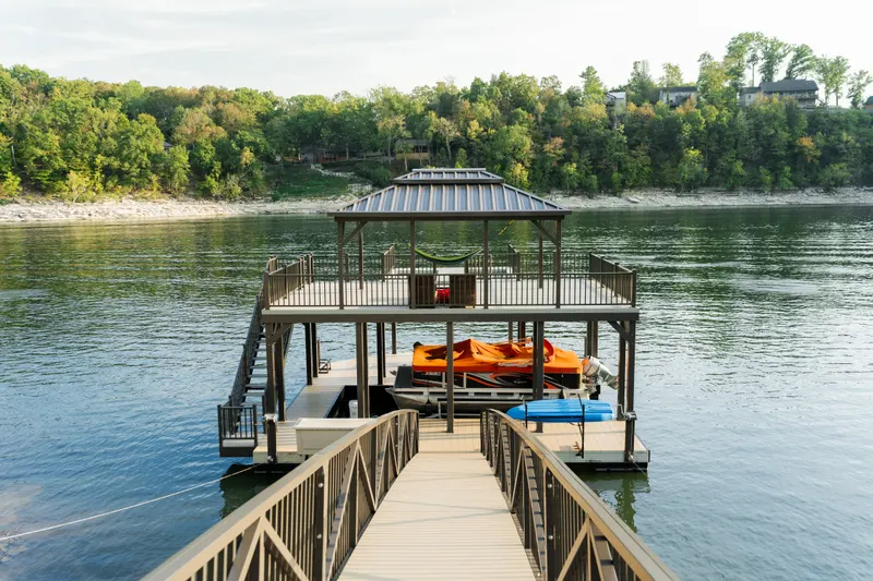 Covered boat dock with a walkway on Herrington Lake