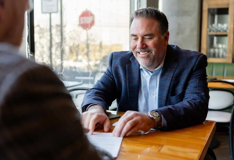 A Luminate Bank mortgage loan officer meeting with clients