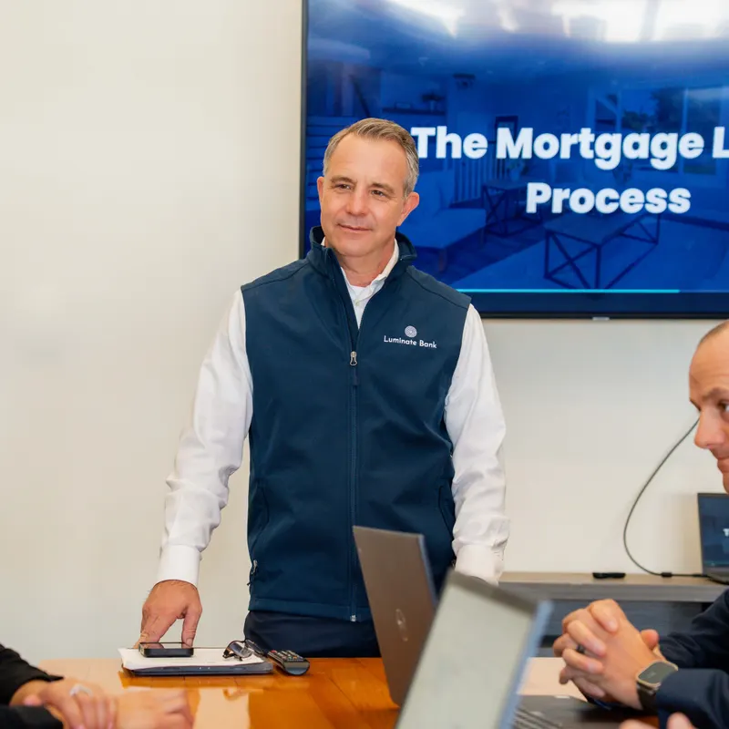 A Luminate Bank mortgage loan officer presenting the mortgage process